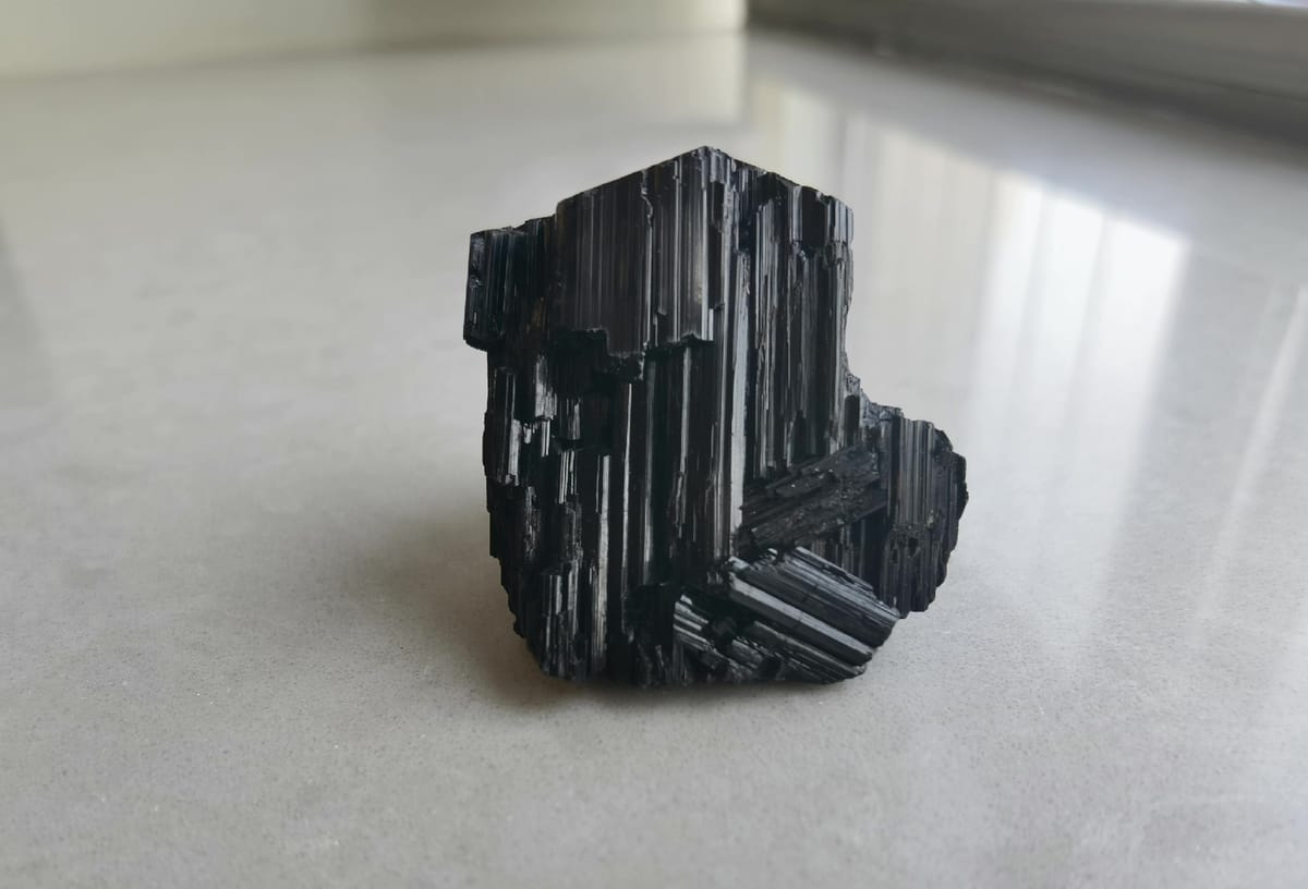 Black Tourmaline Crystal with Stepped Faces — individual mineral specimen view 1