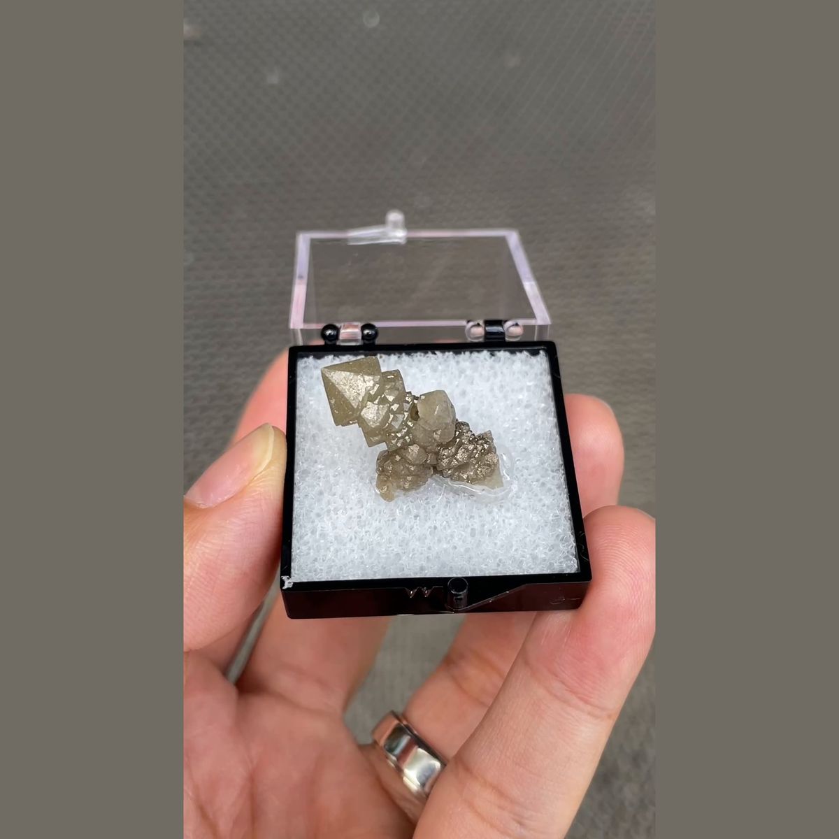 Small screw quartz crystal in display box from Inner Mongolia — complete view