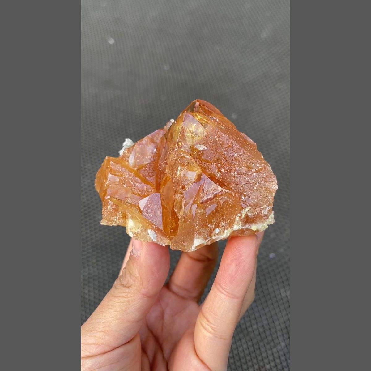 Orange scheelite floater with translucent tip from Xuebaoding, Sichuan — complete view