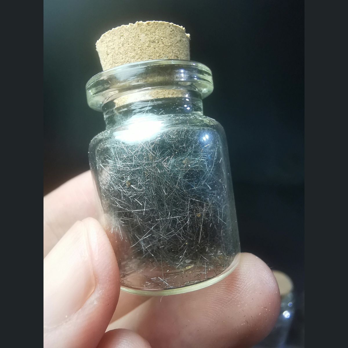 Hair-like Jamesonite Needles in a Glass Vial, natural mineral specimen, photo 1 of 3