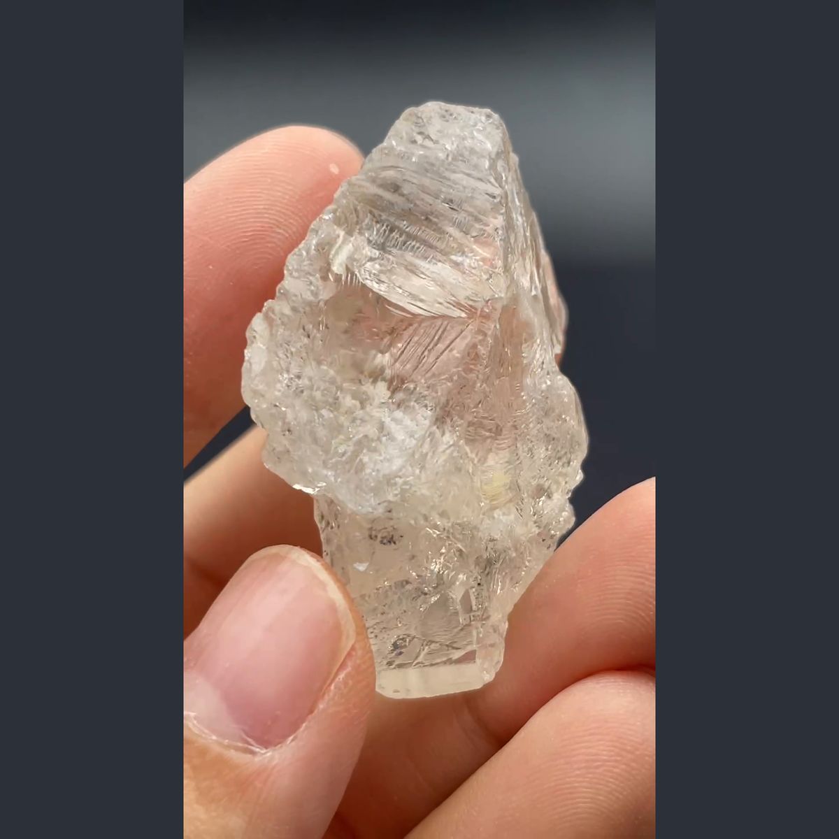 Clear naturally etched topaz crystal from Yunnan — complete view