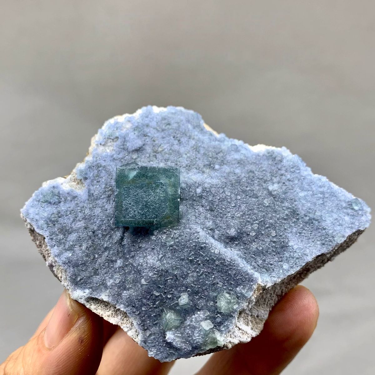 Teal fluorite cube on dusty lavender recrystallised fluorite from Inner Mongolia, China