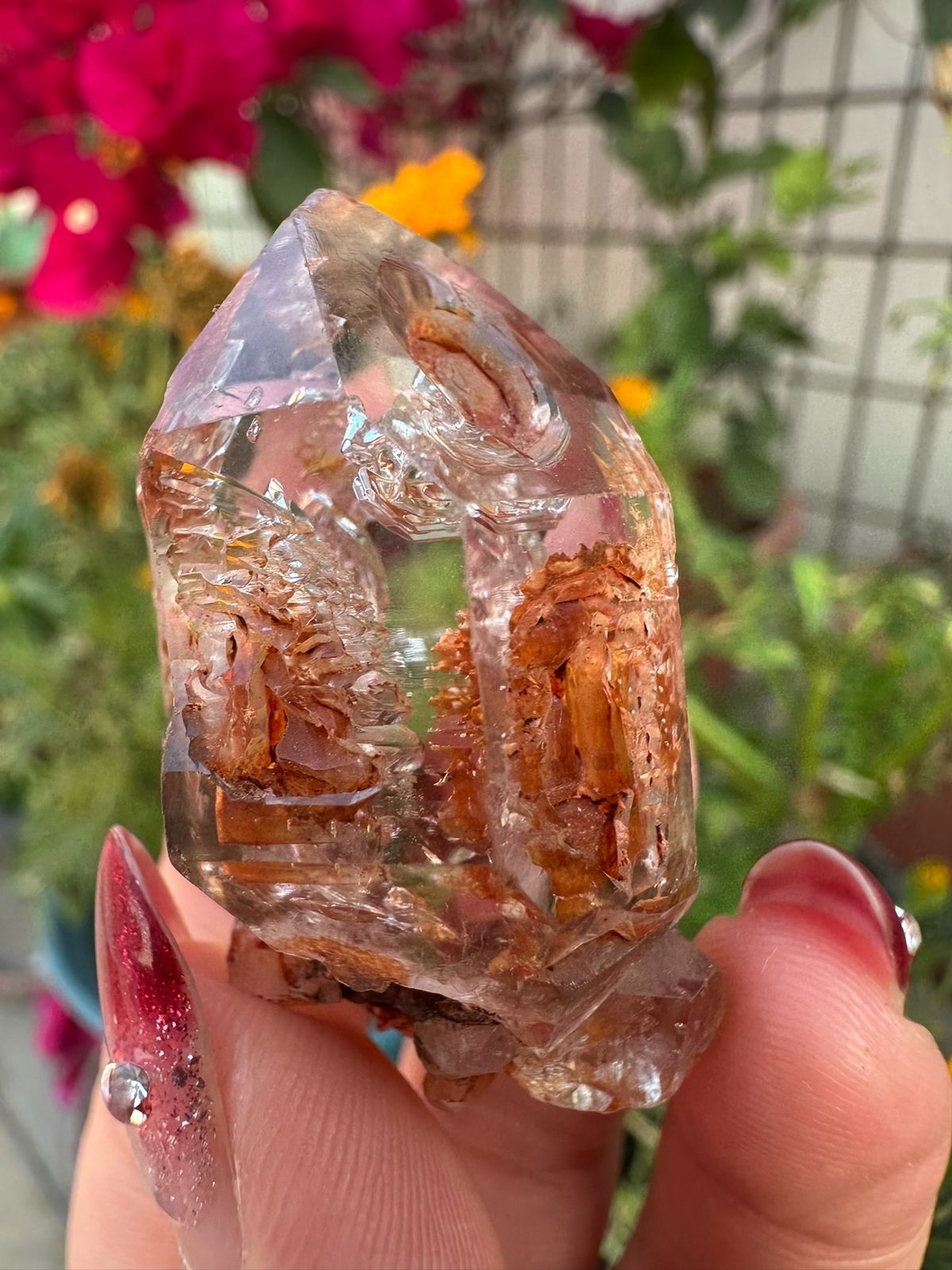 Transparent skeletal quartz with rust-red material from Namibia, specimen view 1