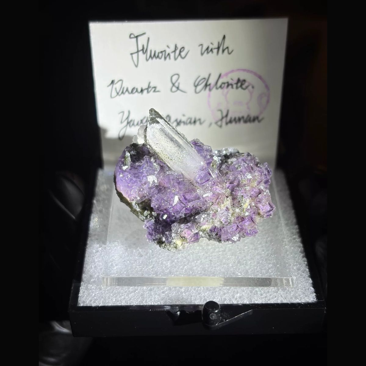 Purple fluorite with an upright quartz point and chlorite from Yaogangxian — complete view