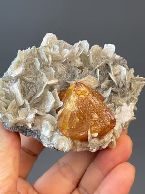 Front view of large orange octahedral scheelite from Xuebaoding