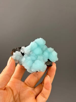 Front view of sky-blue aragonite crystal cluster from Yunnan