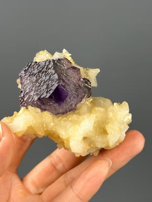 Front view of large etched purple fluorite cluster from Hunan