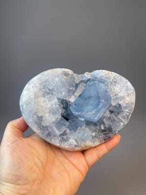 Carved celestite heart specimen from Madagascar with sky blue color