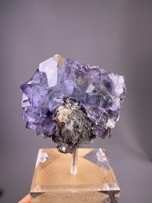 Purple phantom fluorite cluster with pyrite from Yaogangxian, Hunan