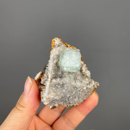Front view of green fluorite cube with white calcite from China