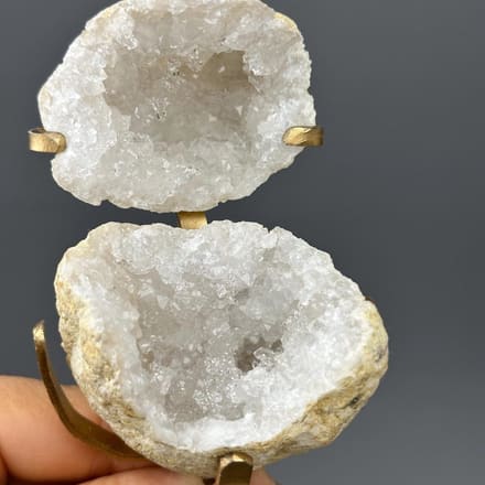 Quartz geode on decorative gold metal display base
