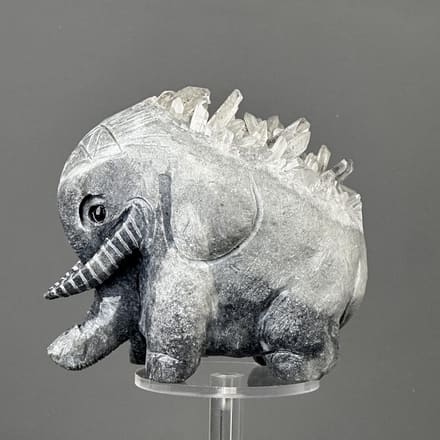 Hand-carved crystal elephant sculpture from natural raw mineral matrix, China