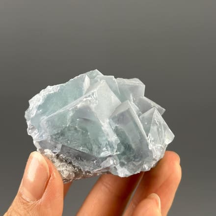 Front view of lake-green and purple twin fluorite from Yaogangxian
