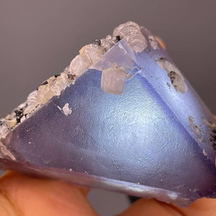 Purple fluorite triangular crystal with calcite, China