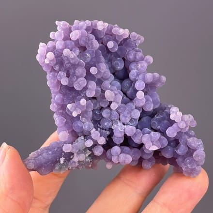Front view of purple botryoidal grape agate from Indonesia