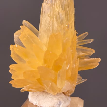 Calcite specimen from Wenshan, Yunnan, China featuring honey-yellow radiating blades