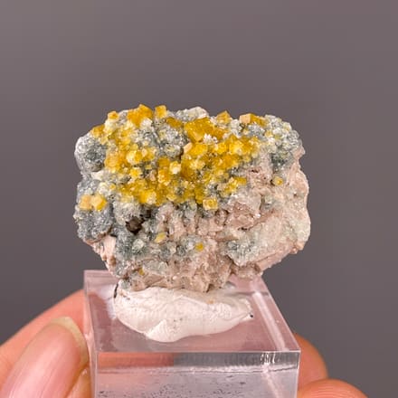 Chabazite specimen from Fujian, China featuring yellow short-prismatic crystal coating
