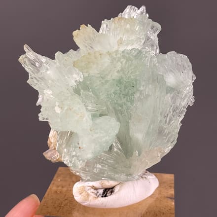 Clustered Blue Aragonite specimen from Yunnan, China featuring pale green radiating fan cluster