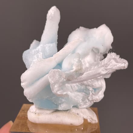 Blue Aragonite specimen from Yunnan, China featuring pale blue and white columns