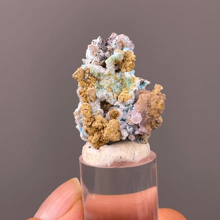Gibbsite specimen from Qinglong, Guizhou, China featuring blue-pink botryoidal material with yellow matrix