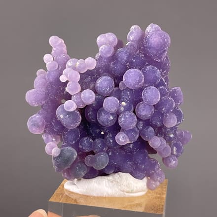 Grape Agate from Indonesia: dense purple nodules with a branching upper edge.