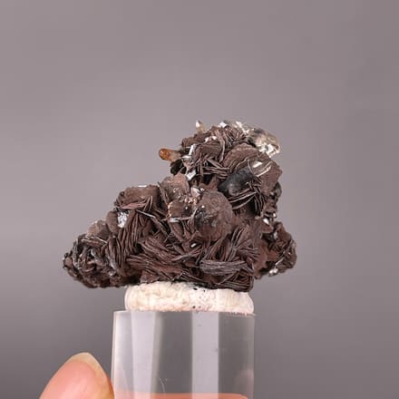 Specular Hematite specimen from Jinlong, Guangdong, China featuring dark radial hematite rosettes