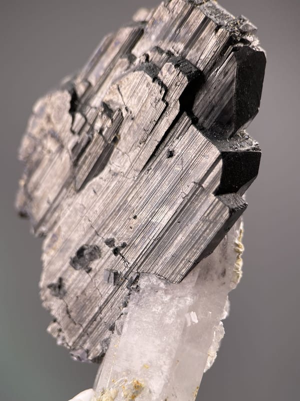 Angled view of Yaogangxian cassiterite highlighting striated faces