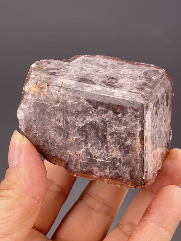 Close-up of calcite showing chocolate-brown colour and faces