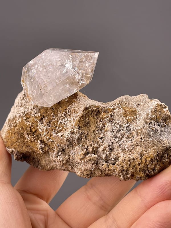 Close-up of quartz crystal termination showing prismatic facets