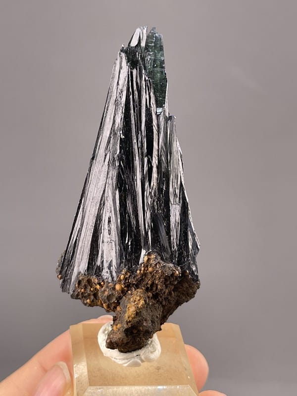 Close-up of hematite crystals showing iridescent metallic surface