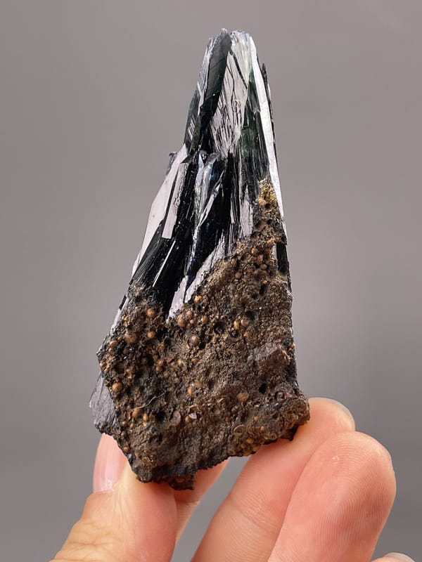 Angled view of Minas Gerais hematite showing colour play on faces