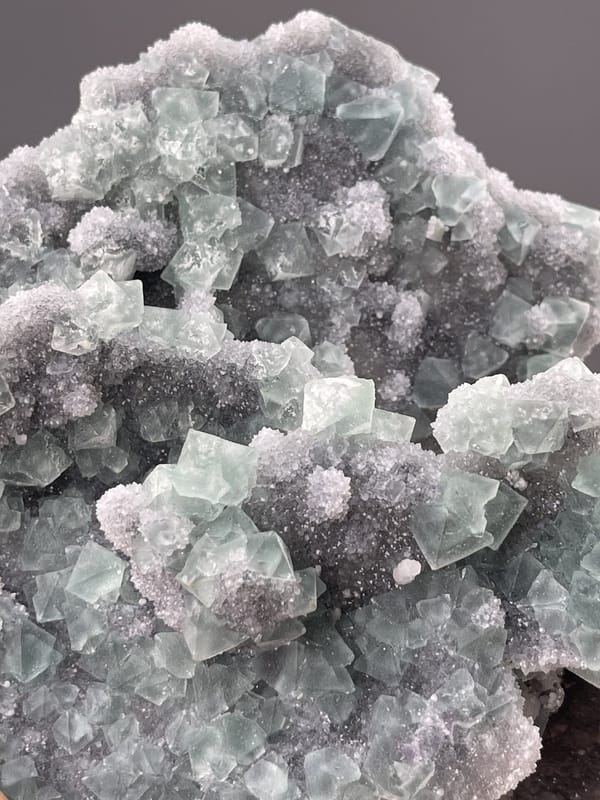 Angled view of Fujian fluorite cluster highlighting green colour