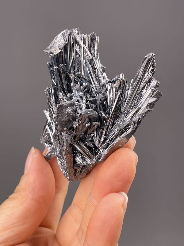 Detail of stibnite surface showing brilliant metallic luster