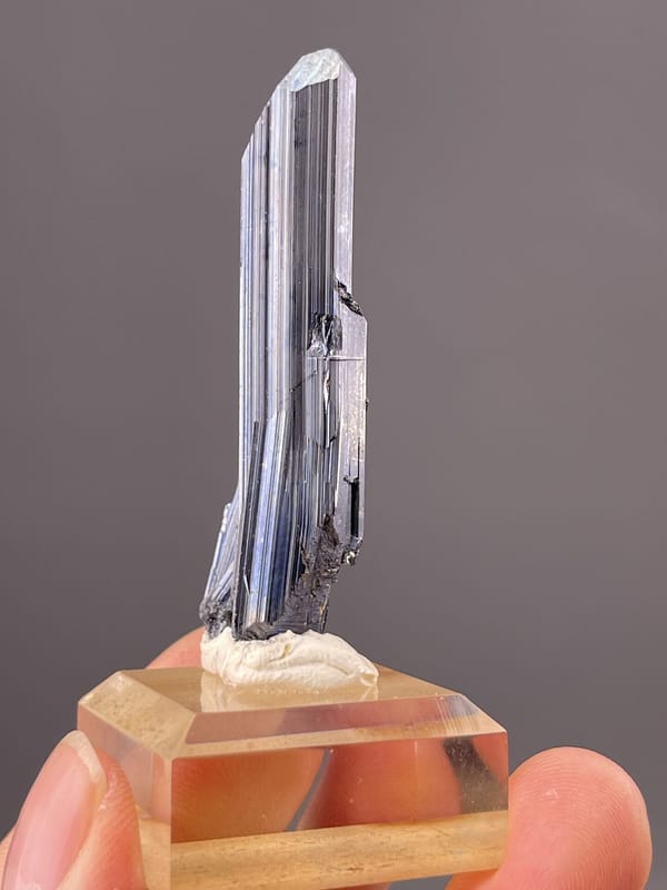 Side view of prismatic stibnite showing full crystal length