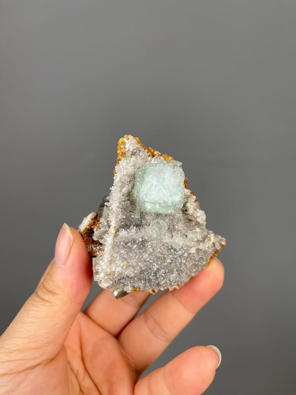 Front view of green fluorite cube with white calcite from China