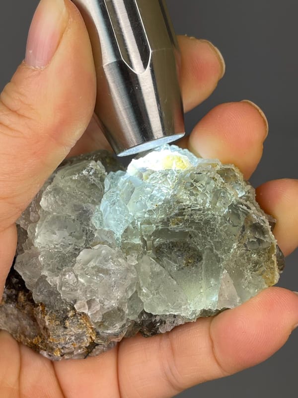 Scale reference of green fluorite cube on matrix