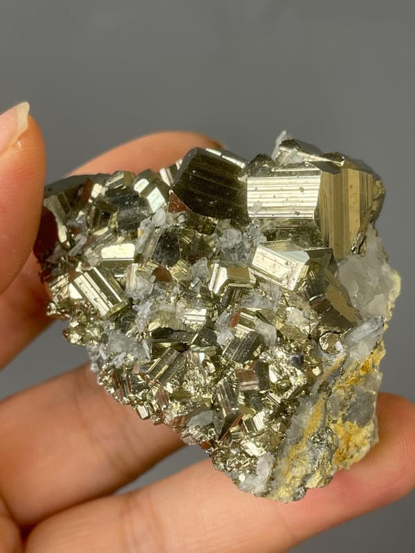 Back view of pyrite and quartz cluster base