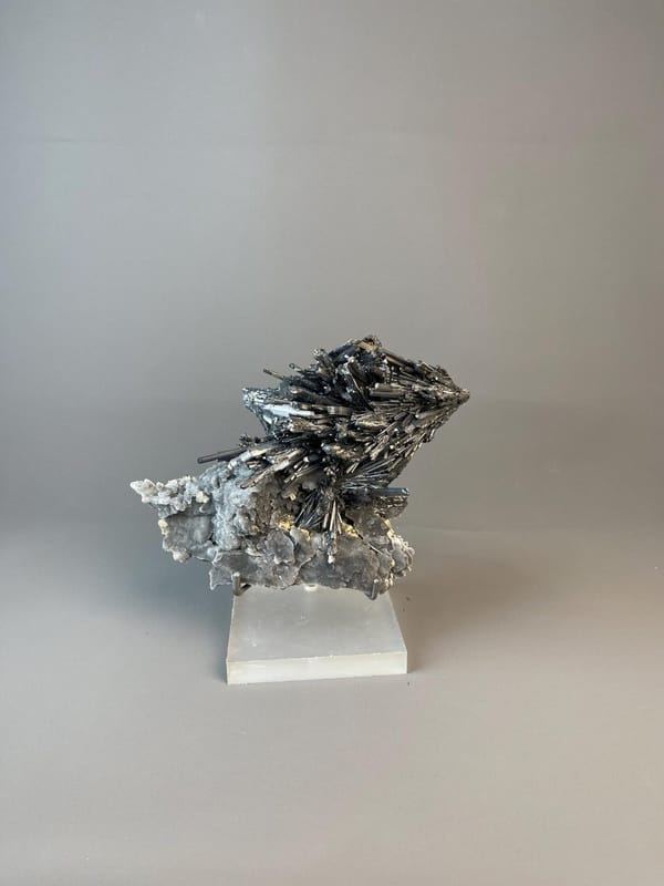 Close-up of elongated metallic stibnite crystal blades