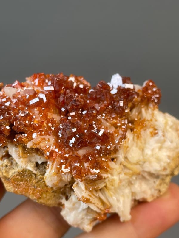 Vanadinite with hexagonal prism habit on iron matrix, Morocco
