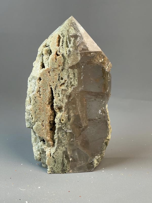 Hand-carved calcite crystal tower with natural color banding