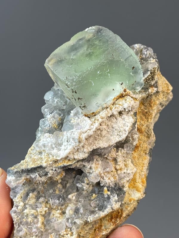 Large well-formed green fluorite cube with sharp crystal faces