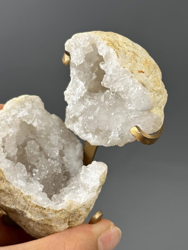 Top view of quartz geode opening on gold stand
