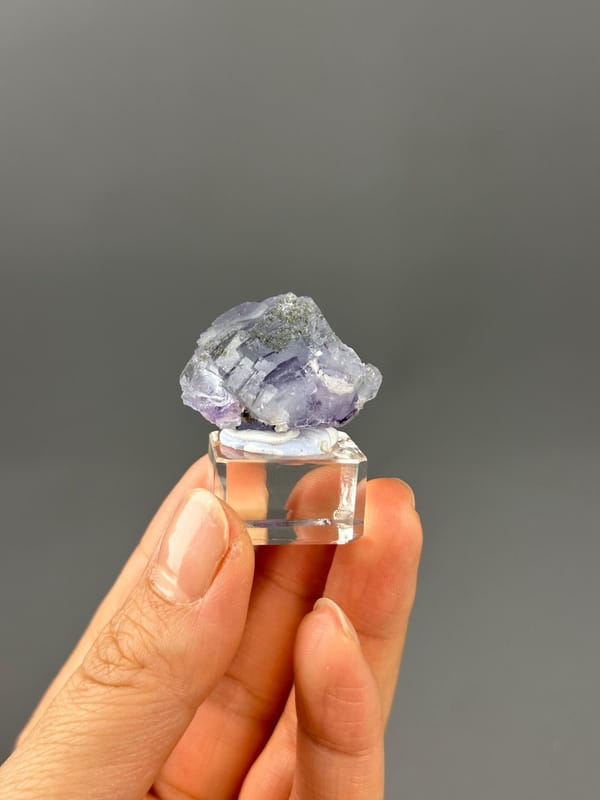Rainbow iridescence inside fluorite crystal detail