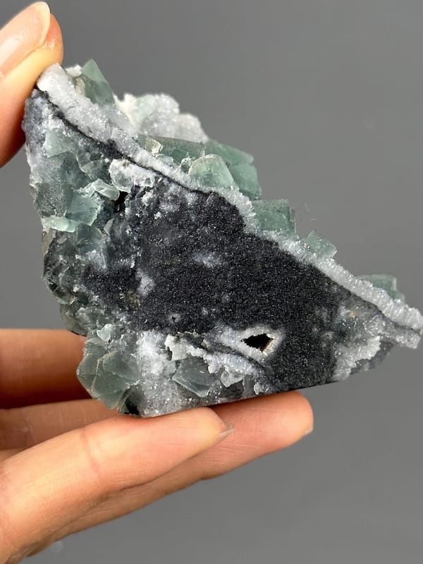 Fluorite octahedral form under quartz coating