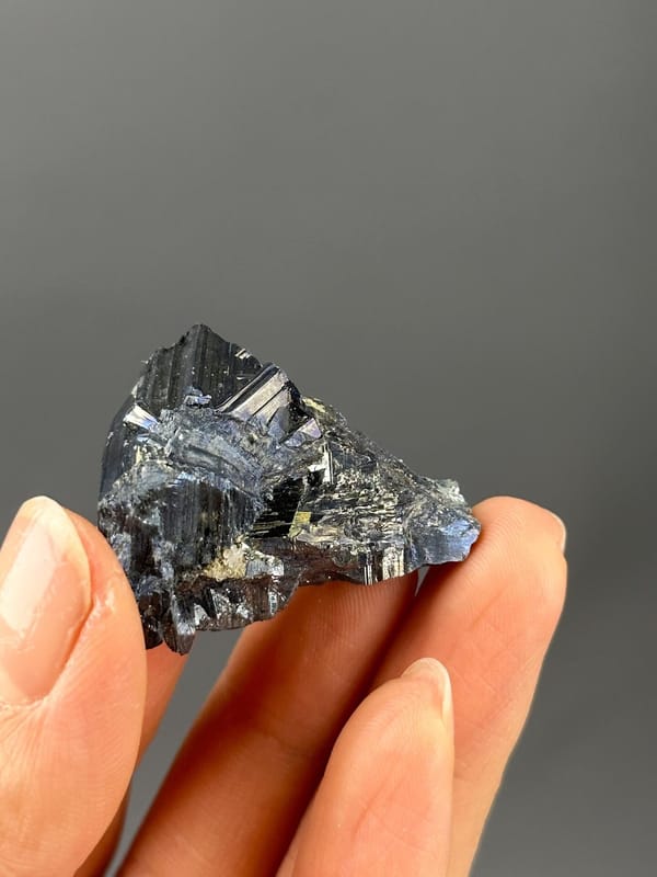 Stibnite crystal tips metallic sheen detail