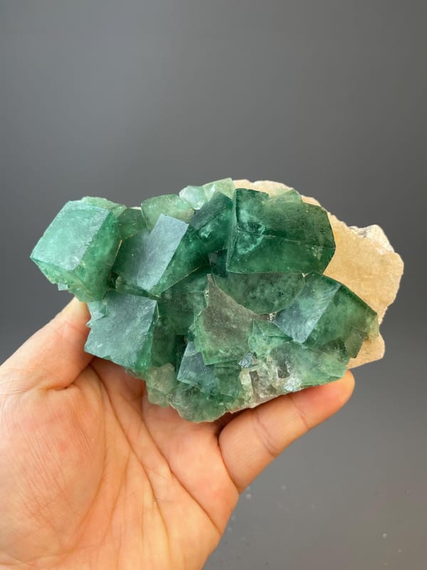 Green fluorite crystal specimen from Madagascar on golden matrix