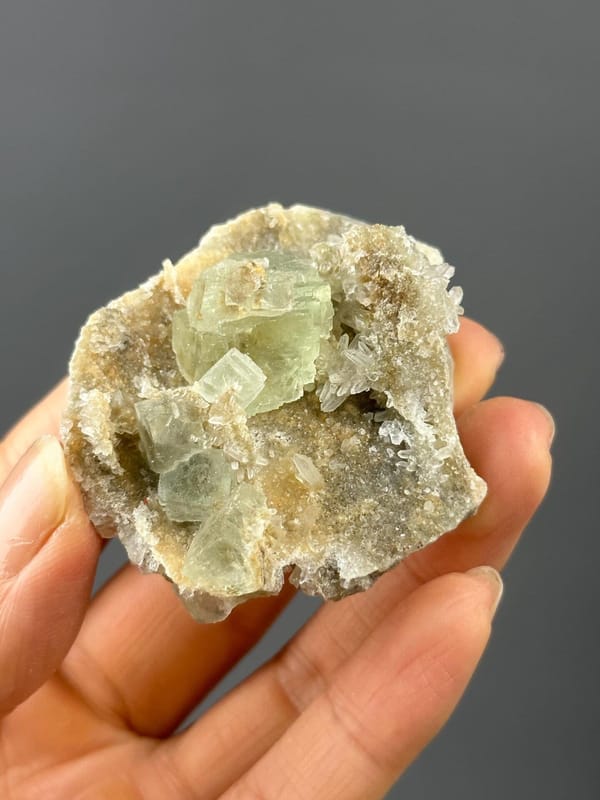 Back view of Xianghualing green fluorite on quartz