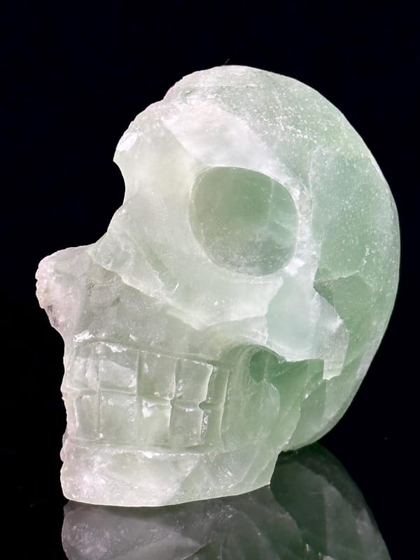 Back view of hand-carved green fluorite skull geode