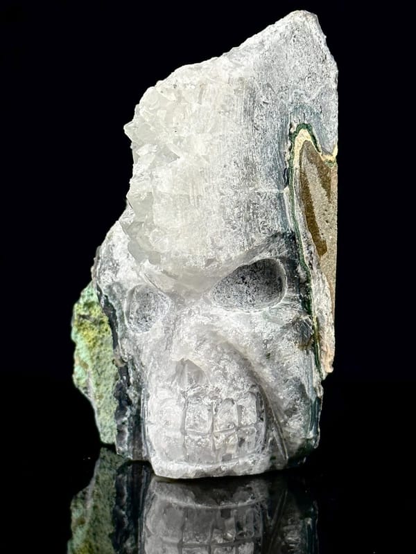 Top view of hand-carved quartz skull showing druzy crystal interior