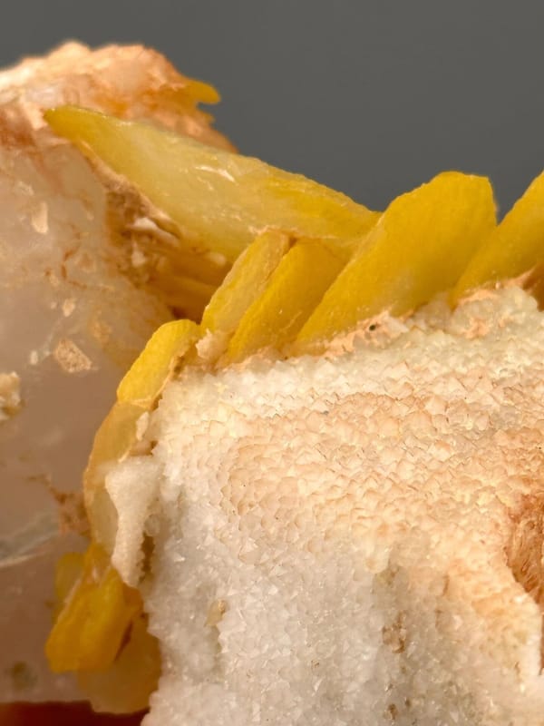 Close-up of yellow calcite surface showing botryoidal texture